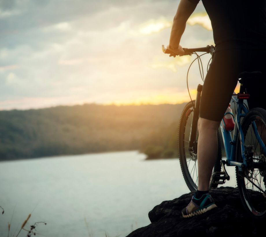 Cyclist Man Racing Bike on Mountain